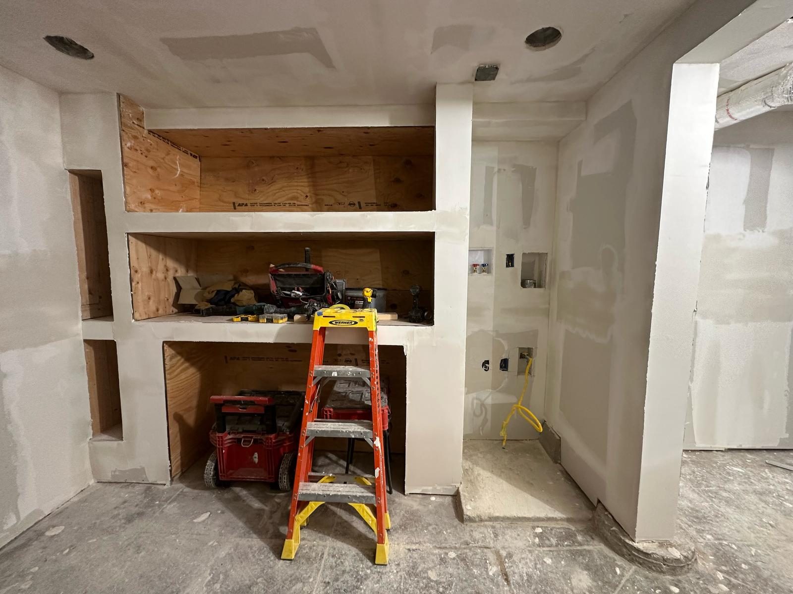 Finished built-in millwork and fireplace surround