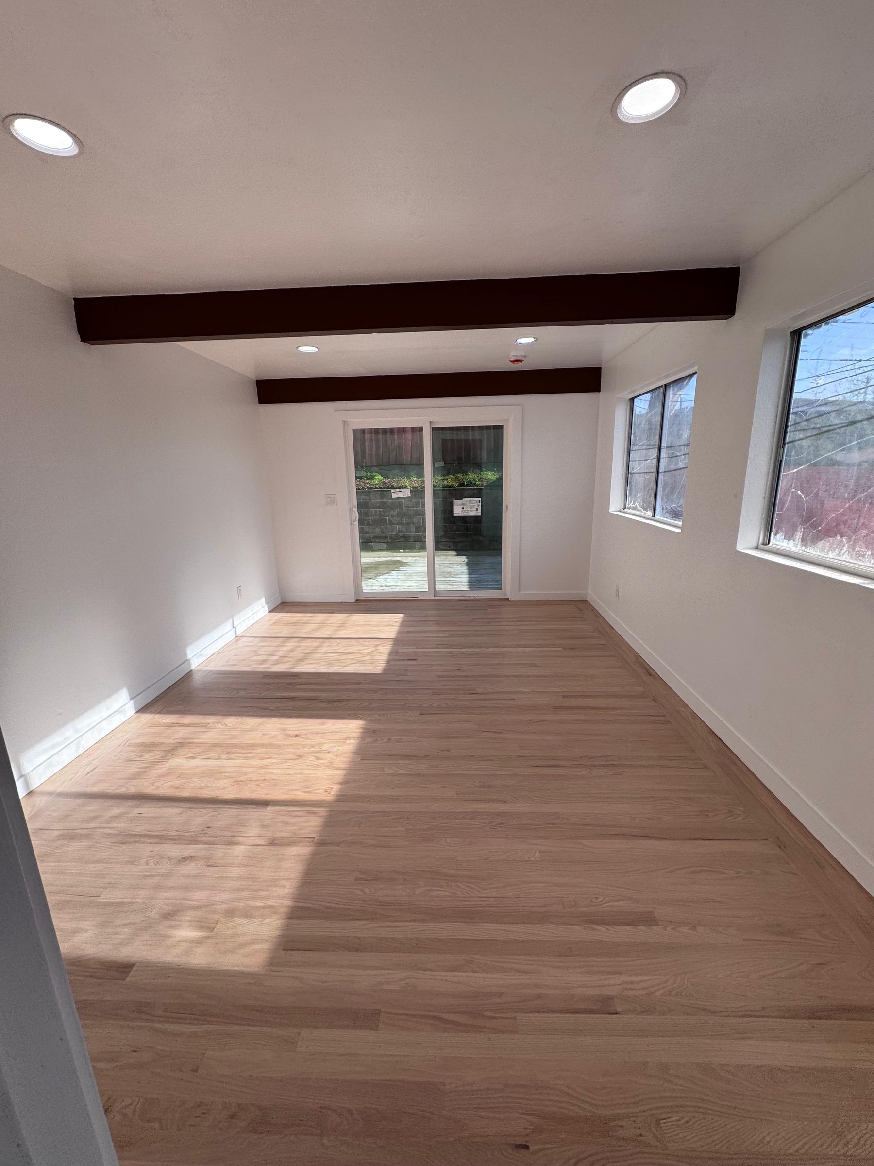 Finished open living space with exposed beams